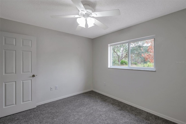 carpeted empty room with a textured ceiling and ceiling fan