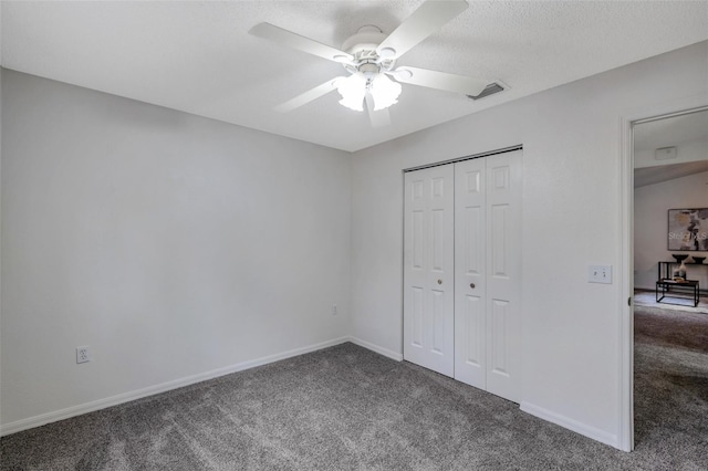 unfurnished bedroom featuring ceiling fan, a closet, and carpet floors