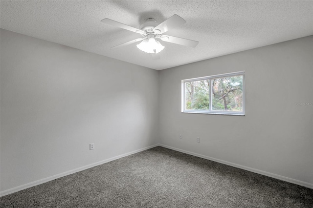 spare room featuring ceiling fan, a textured ceiling, and carpet flooring