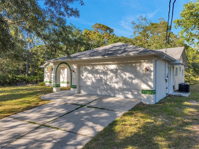 ranch-style home with a front lawn, central AC unit, and a garage