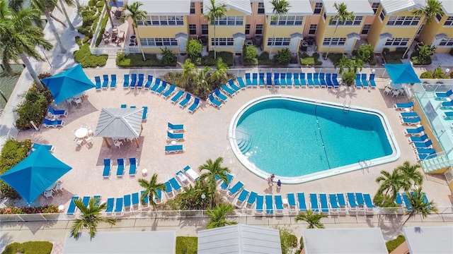 view of swimming pool featuring sink and a patio area