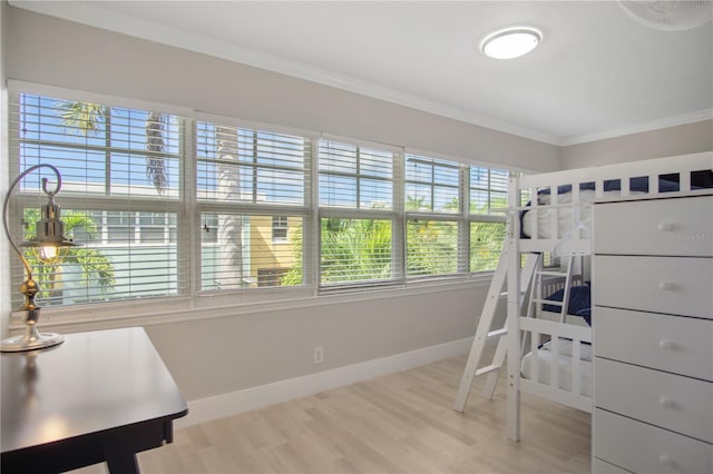 bedroom with hardwood / wood-style flooring and crown molding