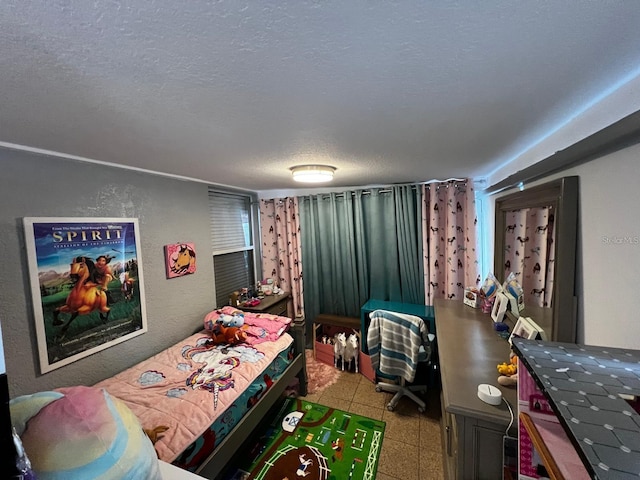 bedroom featuring a textured ceiling