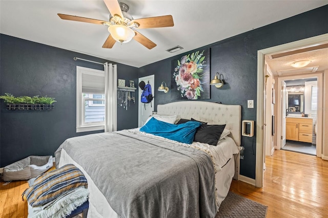 bedroom featuring ceiling fan and light hardwood / wood-style floors