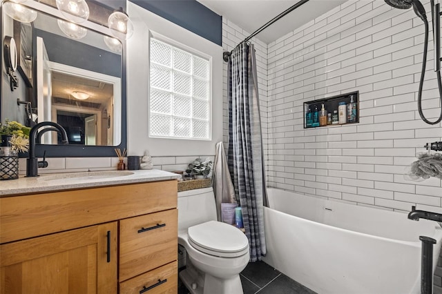 full bathroom featuring toilet, tile patterned floors, shower / bath combo, and vanity