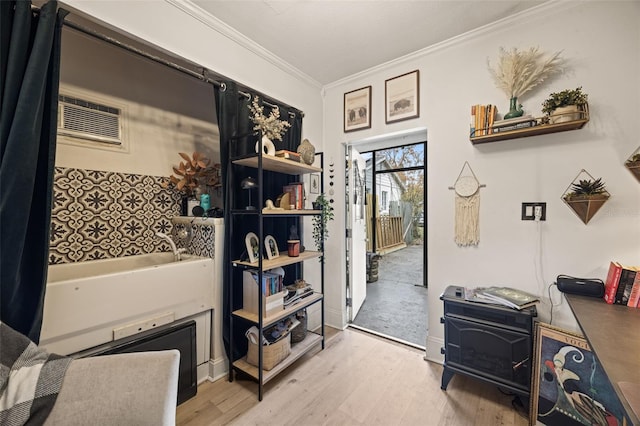 interior space featuring ornamental molding and light hardwood / wood-style flooring