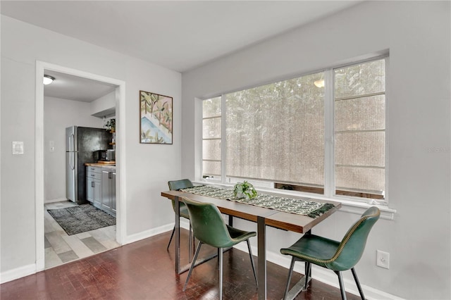 dining area with wood-type flooring