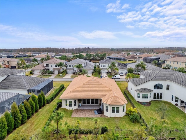 birds eye view of property with a residential view