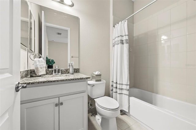 bathroom featuring toilet, visible vents, vanity, tile patterned floors, and shower / tub combo with curtain