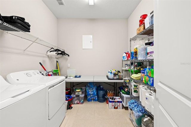 washroom with laundry area, visible vents, and independent washer and dryer