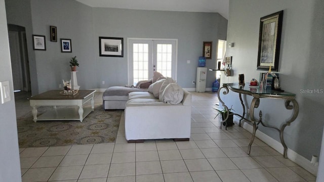 tiled living room featuring french doors