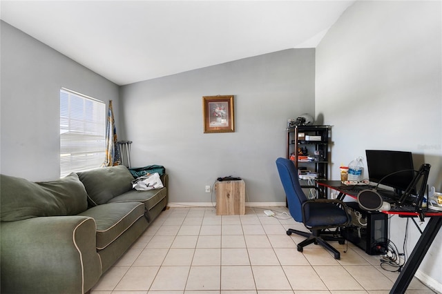 915 Poinsettia Ave, Lehigh Acres, FL 33972 - home office featuring light tile patterned floors, baseboards, and vaulted ceiling