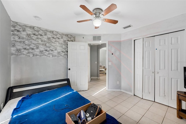 915 Poinsettia Ave, Lehigh Acres, FL 33972 - bedroom featuring arched walkways, visible vents, ceiling fan, and light tile patterned flooring