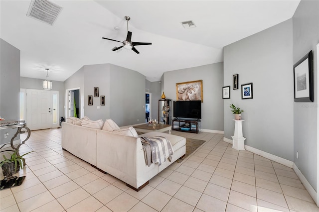 915 Poinsettia Ave, Lehigh Acres, FL 33972 - living area featuring light tile patterned floors, vaulted ceiling, and visible vents