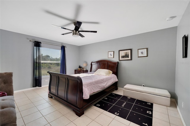 915 Poinsettia Ave, Lehigh Acres, FL 33972 - bedroom featuring light tile patterned floors, baseboards, and ceiling fan