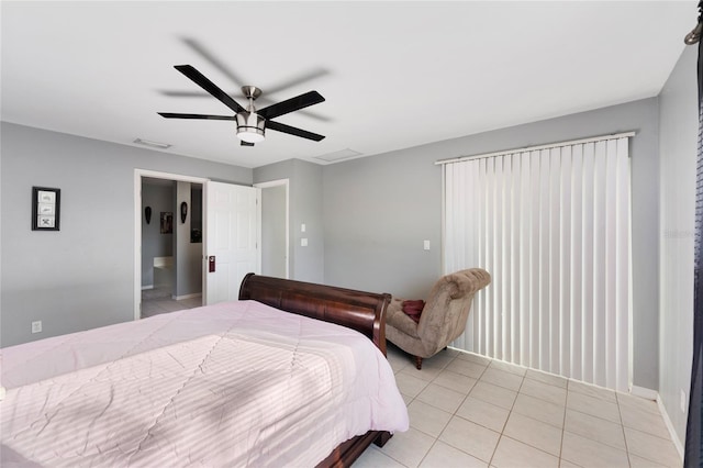 915 Poinsettia Ave, Lehigh Acres, FL 33972 - bedroom with light tile patterned floors, visible vents, connected bathroom, and ceiling fan