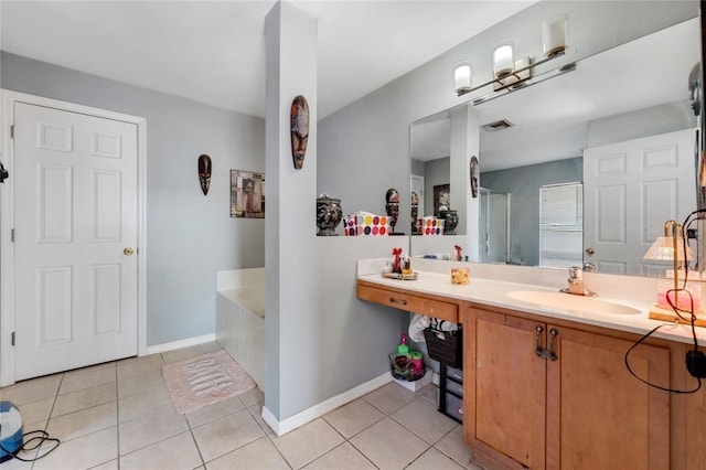 915 Poinsettia Ave, Lehigh Acres, FL 33972 - bathroom with visible vents, a bath, baseboards, vanity, and tile patterned flooring