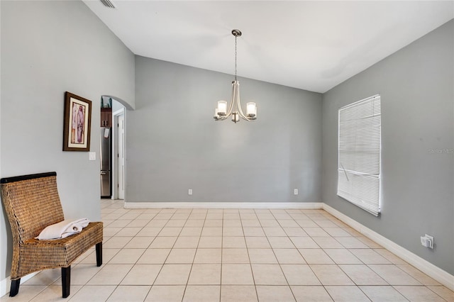 915 Poinsettia Ave, Lehigh Acres, FL 33972 - empty room featuring light tile patterned floors, arched walkways, lofted ceiling, baseboards, and a notable chandelier