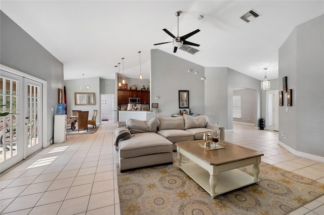 915 Poinsettia Ave, Lehigh Acres, FL 33972 - living room featuring visible vents, light tile patterned floors, arched walkways, a ceiling fan, and french doors