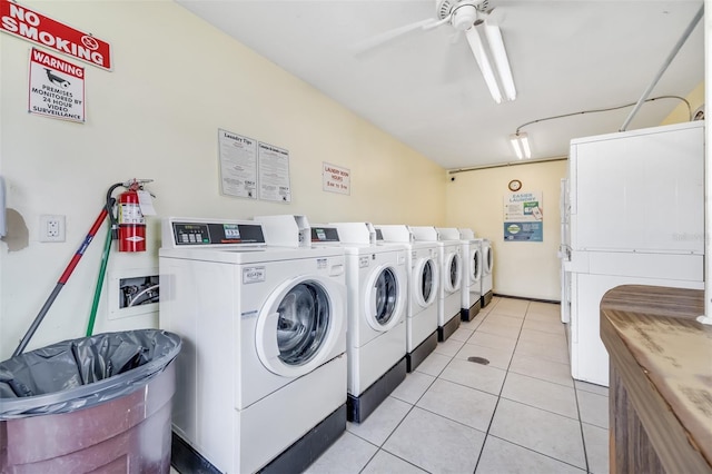 washroom featuring ceiling fan, washer and clothes dryer, and light tile patterned floors