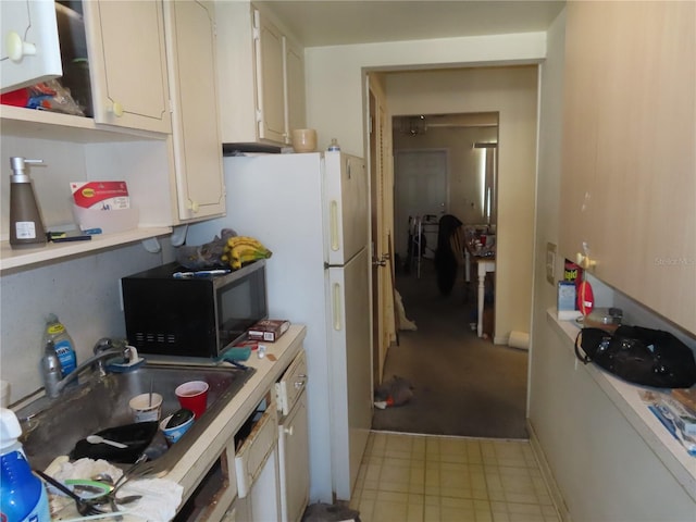 kitchen with white cabinetry and sink