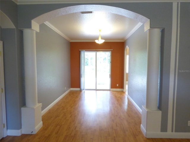 interior space featuring hardwood / wood-style flooring and ornamental molding