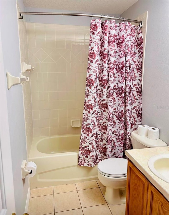 full bathroom with vanity, shower / bathtub combination with curtain, tile patterned floors, and toilet