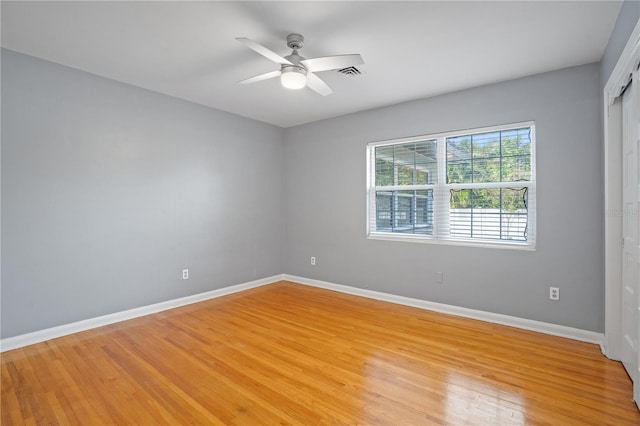 unfurnished room with ceiling fan and light hardwood / wood-style flooring