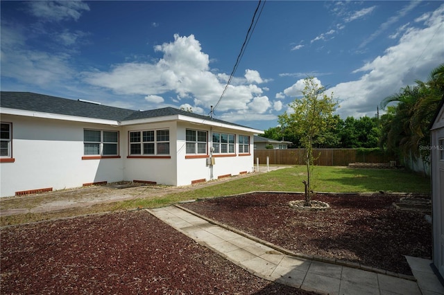 view of property exterior featuring a lawn