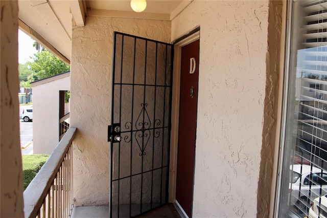 entrance to property featuring a balcony