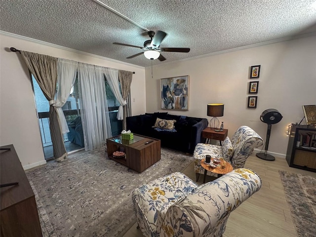 living room with a textured ceiling, ceiling fan, crown molding, and hardwood / wood-style flooring