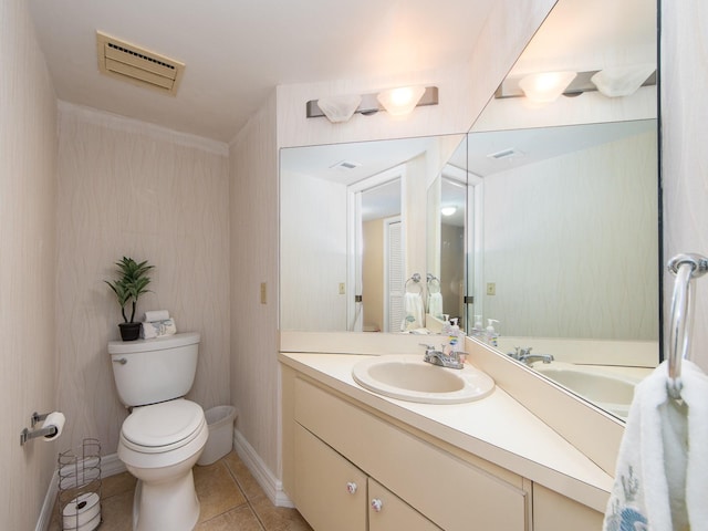 bathroom featuring tile patterned floors, toilet, and vanity