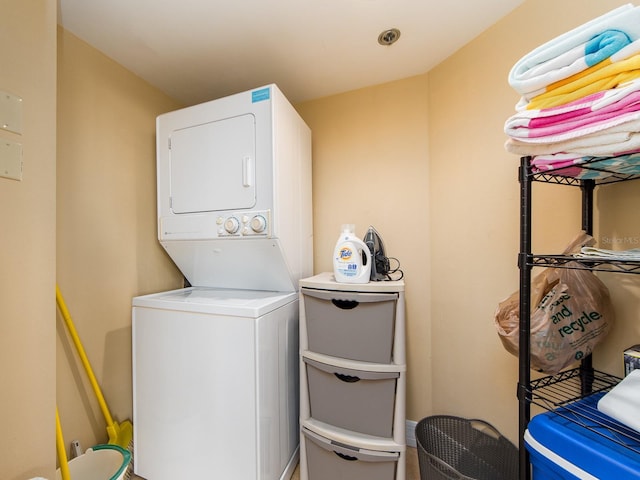 washroom with stacked washer / drying machine