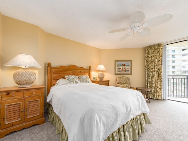 carpeted bedroom featuring a textured ceiling, access to outside, and ceiling fan