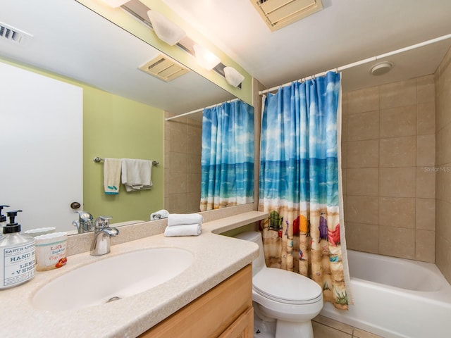 full bathroom featuring vanity, tile patterned floors, shower / bath combination with curtain, and toilet