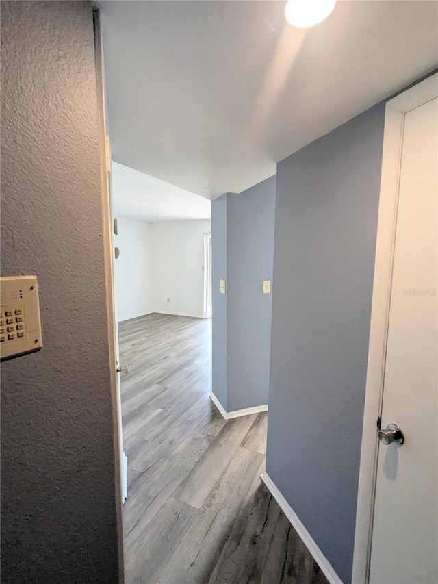 hallway featuring light hardwood / wood-style floors