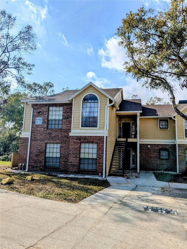 view of front of house featuring brick siding