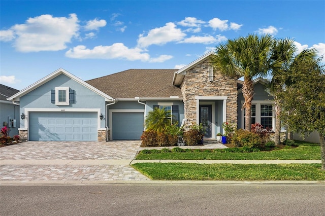 view of front of home with a garage and a front yard