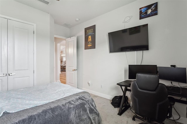 bedroom featuring a closet and carpet flooring