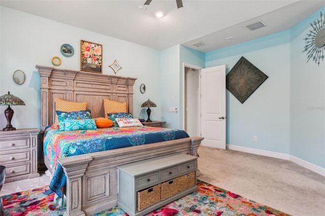 bedroom with ceiling fan and light carpet