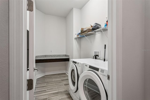 clothes washing area featuring independent washer and dryer