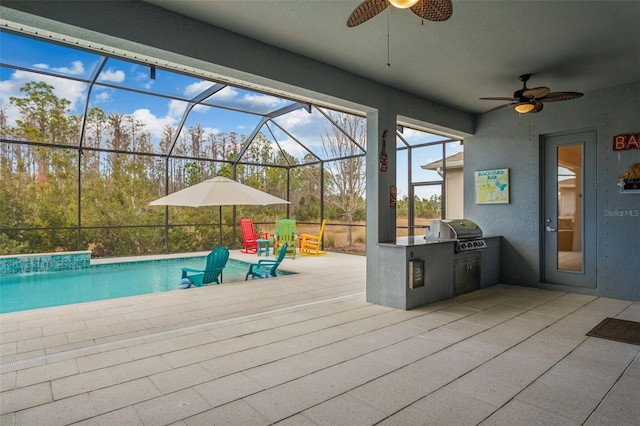 exterior space with area for grilling, glass enclosure, ceiling fan, exterior kitchen, and a patio