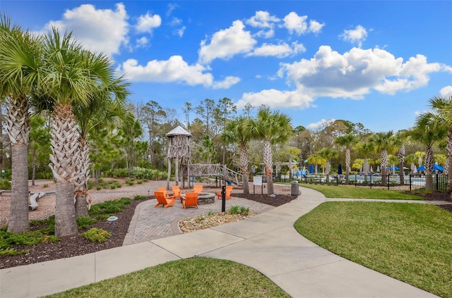 view of home's community featuring a lawn