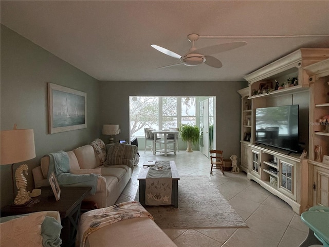 living room featuring ceiling fan and light tile patterned flooring