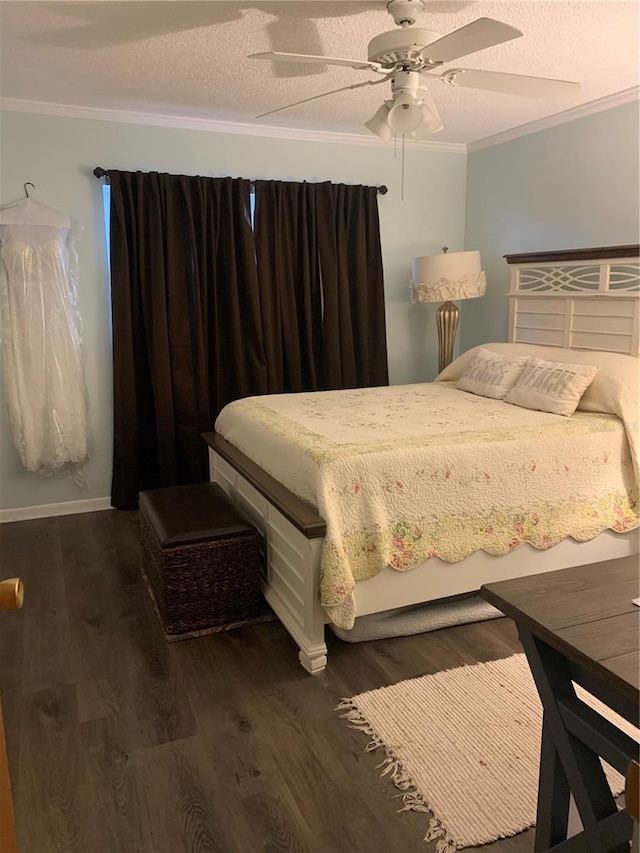 bedroom featuring ornamental molding, dark hardwood / wood-style floors, and a textured ceiling