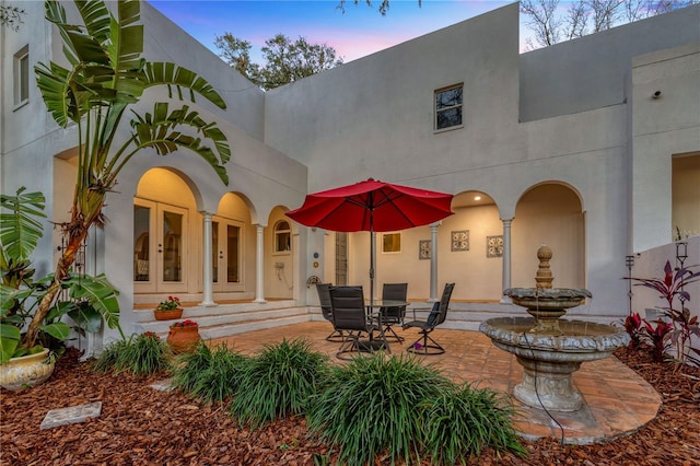 patio terrace at dusk with french doors