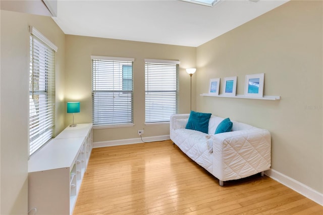 living area with light hardwood / wood-style flooring