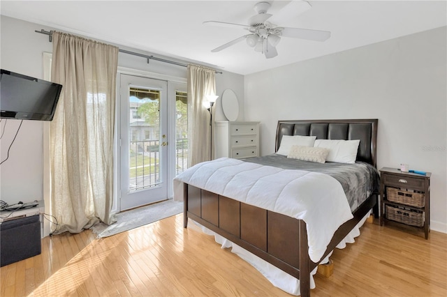 bedroom featuring ceiling fan, access to exterior, and light hardwood / wood-style flooring