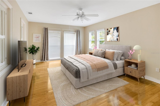 bedroom featuring ceiling fan and light hardwood / wood-style flooring