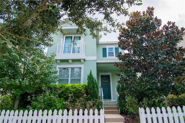 view of front of house with a balcony